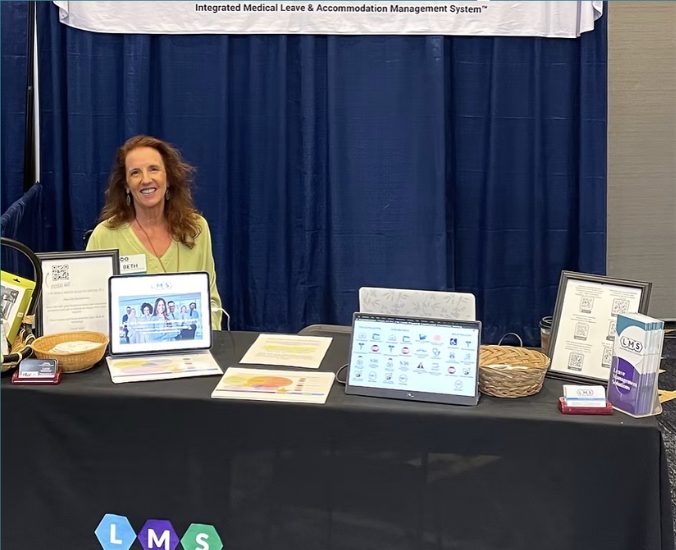 Beth De Lima at the HRWest Conference Booth